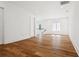 Spacious living room with hardwood floors and a staircase at 4614 W Tennyson Ave, Tampa, FL 33629
