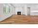 Large open living room with fireplace, access to an outdoor area, and lots of natural light at 4614 W Tennyson Ave, Tampa, FL 33629