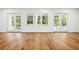 Living room with hardwood floors, natural lighting and French doors at 4614 W Tennyson Ave, Tampa, FL 33629