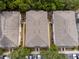 Townhome rooftops with trees, and parking available near the residences, offering convenience and community living at 4734 Chatterton Way, Riverview, FL 33578