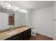 Well-lit bathroom featuring double sinks, granite countertops, and a combination bathtub and shower at 4734 Chatterton Way, Riverview, FL 33578