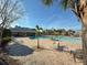 Resort-style pool with lounge chairs and a covered pavilion offers a relaxing community space at 4734 Chatterton Way, Riverview, FL 33578