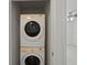 Efficient laundry closet with stacked washer and dryer appliances at 4734 Chatterton Way, Riverview, FL 33578