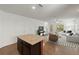 Bright living room featuring white walls, tile floors, and minimalist furniture arrangement at 4734 Chatterton Way, Riverview, FL 33578