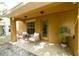 Cozy covered patio with seating, perfect for relaxing outdoors in a private space at 4734 Chatterton Way, Riverview, FL 33578