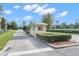 Community entrance guard house with professional landscaping, and a well-maintained setting at 8150 Southern Pines Dr, Brooksville, FL 34601