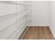 Bright walk-in closet boasts wire shelving and laminate flooring, perfect for organized storage at 8150 Southern Pines Dr, Brooksville, FL 34601