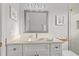 Bright bathroom featuring white cabinetry, stylish countertop, and modern fixtures, offering a clean and updated space at 1881 Riveredge Dr, Tarpon Springs, FL 34689