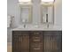 Bathroom vanity featuring double sinks, granite countertops, and plentiful drawer and cabinet space at 1881 Riveredge Dr, Tarpon Springs, FL 34689
