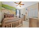 Adorable bedroom featuring a mural and a wooden bed frame at 1881 Riveredge Dr, Tarpon Springs, FL 34689