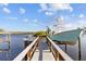 Waterfront property featuring private boat dock and lift for easy access to the water at 1881 Riveredge Dr, Tarpon Springs, FL 34689