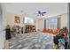 Spacious bonus room offers lots of natural light and space for activities at 1881 Riveredge Dr, Tarpon Springs, FL 34689