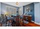 Charming dining area features a custom bar and ample natural light from the large window at 1881 Riveredge Dr, Tarpon Springs, FL 34689
