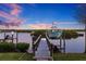 Dock with boat lift on the canal at 1881 Riveredge Dr, Tarpon Springs, FL 34689