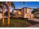A large two-story home with a well-manicured lawn at 1881 Riveredge Dr, Tarpon Springs, FL 34689