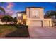 Beautiful two-story home featuring a three-car garage at 1881 Riveredge Dr, Tarpon Springs, FL 34689