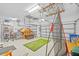 Spacious garage equipped with sports equipment, storage solutions, and ample room for parking; functional and organized at 1881 Riveredge Dr, Tarpon Springs, FL 34689