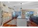 Bright kitchen with custom cabinets, granite counters, stainless appliances, and an island with breakfast bar at 1881 Riveredge Dr, Tarpon Springs, FL 34689