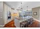Well-equipped kitchen featuring custom cabinetry, granite countertops, stainless steel appliances and an island with seating at 1881 Riveredge Dr, Tarpon Springs, FL 34689