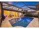 Covered outdoor pool and patio area for entertaining at 1881 Riveredge Dr, Tarpon Springs, FL 34689