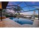 Screened in-ground pool overlooking a scenic canal at 1881 Riveredge Dr, Tarpon Springs, FL 34689