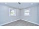 Sun-filled bedroom with modern floors, two large windows, and recessed lighting at 245 58Th N St, St Petersburg, FL 33710