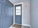 Entryway view of gray door showing closet for storage at 245 58Th N St, St Petersburg, FL 33710
