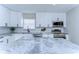 Close up of kitchen featuring stainless steel appliances, white cabinets, herringbone backsplash, and beautiful stone countertop at 245 58Th N St, St Petersburg, FL 33710