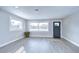 Open living area with new flooring, modern design, and plenty of natural light at 245 58Th N St, St Petersburg, FL 33710