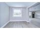 Neutral living room showcasing new floors, fresh paint and a light and airy atmosphere at 245 58Th N St, St Petersburg, FL 33710