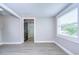 Neutral living room showcasing new floors, fresh paint and a light and airy atmosphere at 245 58Th N St, St Petersburg, FL 33710
