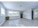 Bright living room with wood-look floors, recessed lighting, and natural light at 245 58Th N St, St Petersburg, FL 33710