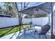 Cozy patio area featuring a modern gazebo, stylish chairs, and a vibrant blue rug for outdoor relaxation at 245 58Th N St, St Petersburg, FL 33710