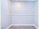 Empty walk-in closet with ample storage space and modern flooring and trim at 245 58Th N St, St Petersburg, FL 33710