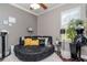 Bedroom features unique decor, a large round sofa, and ample natural light, creating a cozy and inviting atmosphere at 27045 Firebush Dr, Wesley Chapel, FL 33544