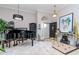 Grand foyer features a black piano, bright lighting, and neutral walls at 27045 Firebush Dr, Wesley Chapel, FL 33544