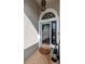 Front entryway featuring a decorative storm door and brick flooring at 27045 Firebush Dr, Wesley Chapel, FL 33544
