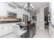 Elegant kitchen with granite countertops, stainless steel appliances, and a kitchen island at 27045 Firebush Dr, Wesley Chapel, FL 33544