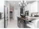 Charming kitchen with granite countertops, stainless steel appliances, and a kitchen island at 27045 Firebush Dr, Wesley Chapel, FL 33544
