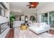 Bright living room featuring a modern fireplace, plush white rug, and open floor plan at 27045 Firebush Dr, Wesley Chapel, FL 33544
