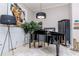 Cozy living room featuring a grand piano and stylish decor at 27045 Firebush Dr, Wesley Chapel, FL 33544