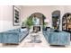 Elegant living room with stylish furnishings and an open archway at 27045 Firebush Dr, Wesley Chapel, FL 33544