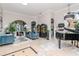 Elegant living room with archways, a grand piano, and stylish furnishings, perfect for entertaining at 27045 Firebush Dr, Wesley Chapel, FL 33544