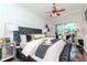 Luxurious main bedroom with a seating area features stylish furniture, elegant decor and plenty of natural light at 27045 Firebush Dr, Wesley Chapel, FL 33544
