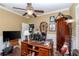 Home office with a wooden desk, computer, and decorative accessories at 27045 Firebush Dr, Wesley Chapel, FL 33544