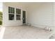 View of a back porch with modern white siding and a glass door at 5327 6Th N Ave, St Petersburg, FL 33710