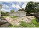 Spacious backyard features two modern white accessory buildings and ample green space at 5327 6Th N Ave, St Petersburg, FL 33710