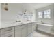 Bathroom showcasing double vanity, freestanding tub, and gold accents at 5327 6Th N Ave, St Petersburg, FL 33710