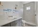 Bathroom with a large walk-in shower with gray subway tiles and dual vanity at 5327 6Th N Ave, St Petersburg, FL 33710