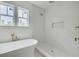 Modern bathroom with freestanding tub, a walk-in shower, and gold fixtures at 5327 6Th N Ave, St Petersburg, FL 33710